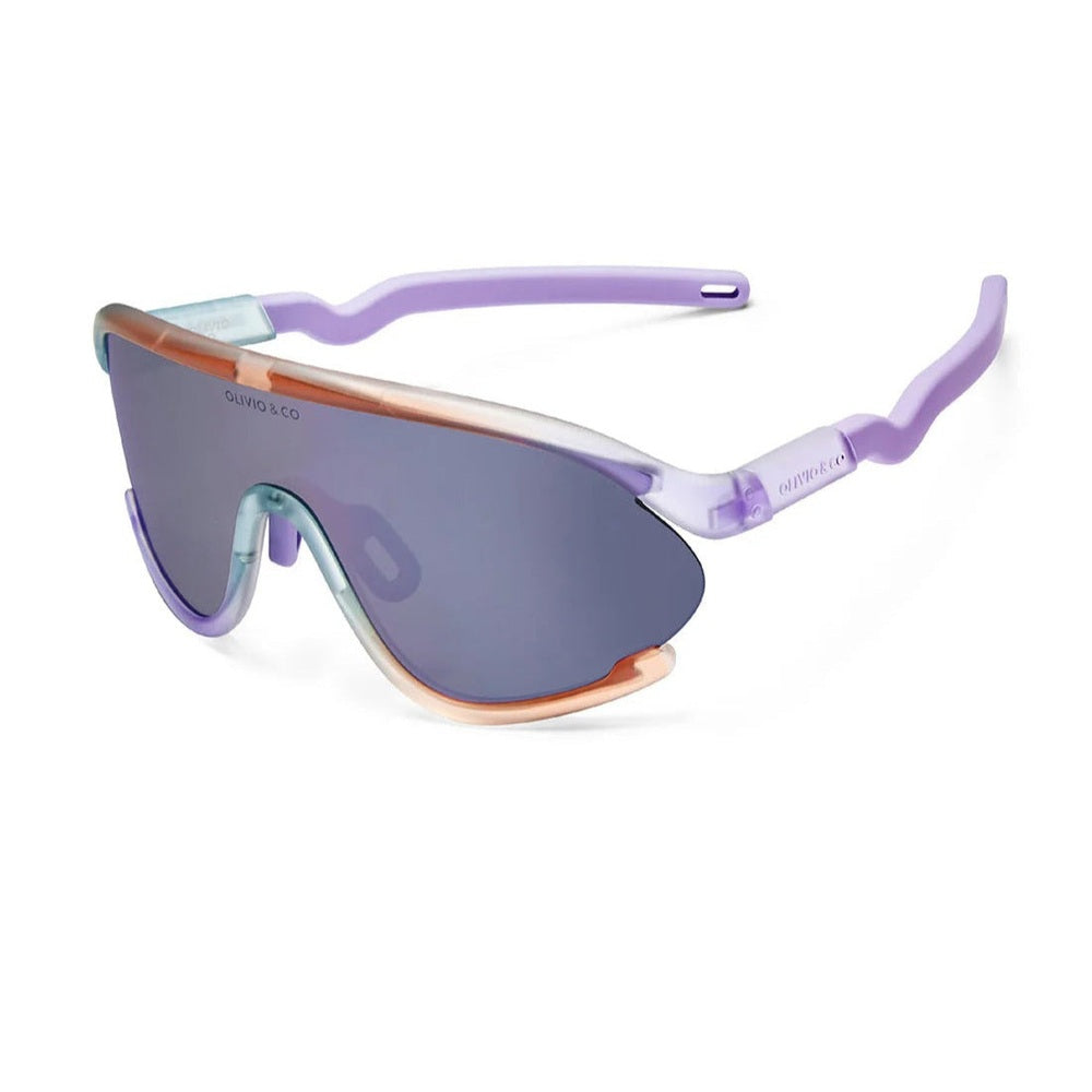 Olivio & Co Sport Sunglasses Kids full-rim lilac frame, blue mirrored lenses, orange nose bridge, in action.