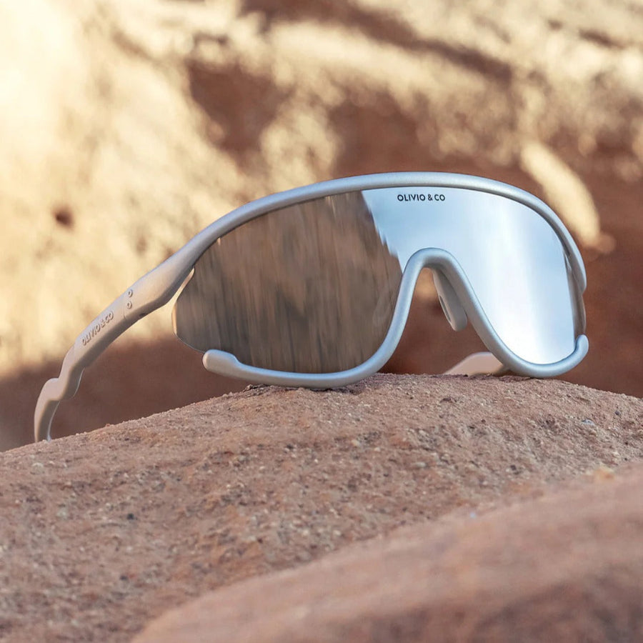 Junior sport sunglasses by OLIVIO & CO, white full-rim frame with space-silver mirrored lenses.