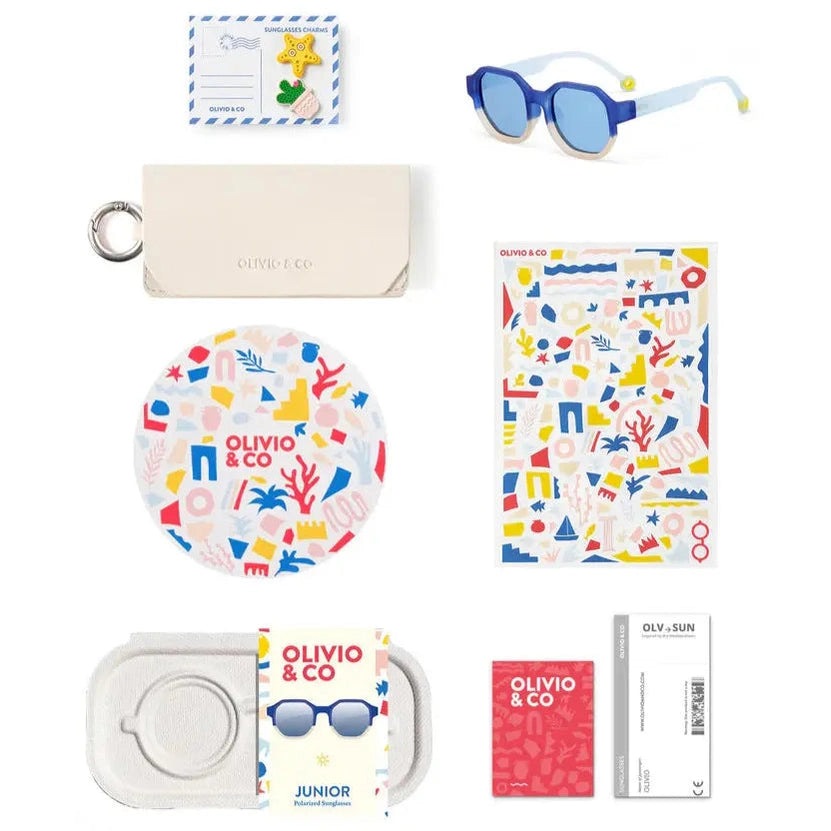 Olivio & Co Square Sunglasses Junior+ Creative Edition D Deep Sea blue frames beside case and sticker sheet