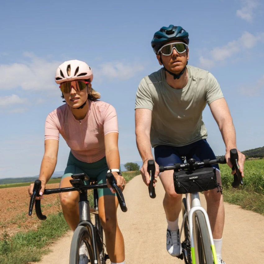 Olivio & Co Sport Sunglasses Half-Rim Flamingo Pink worn by cyclists outdoors