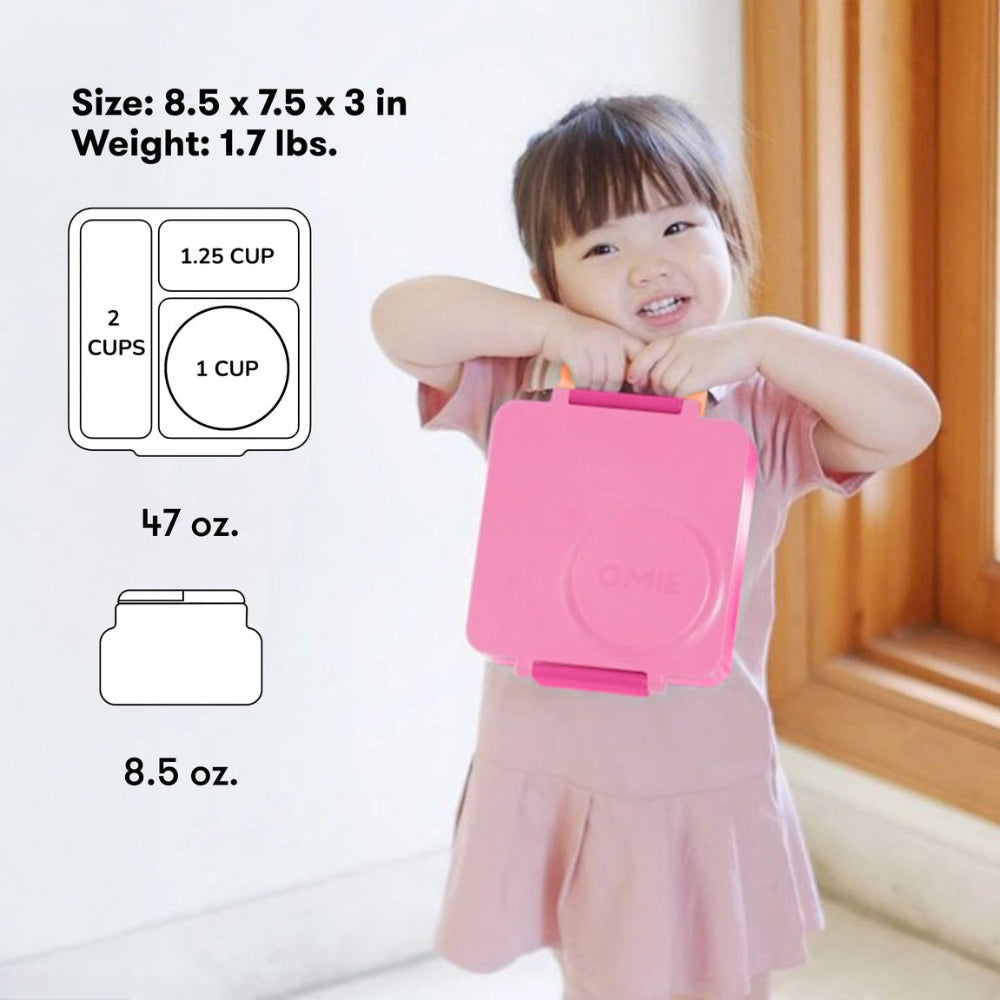 OmieBox Version 2 pink lunch container, clearly showing 2-cup and 1-cup compartments as a child holds it.