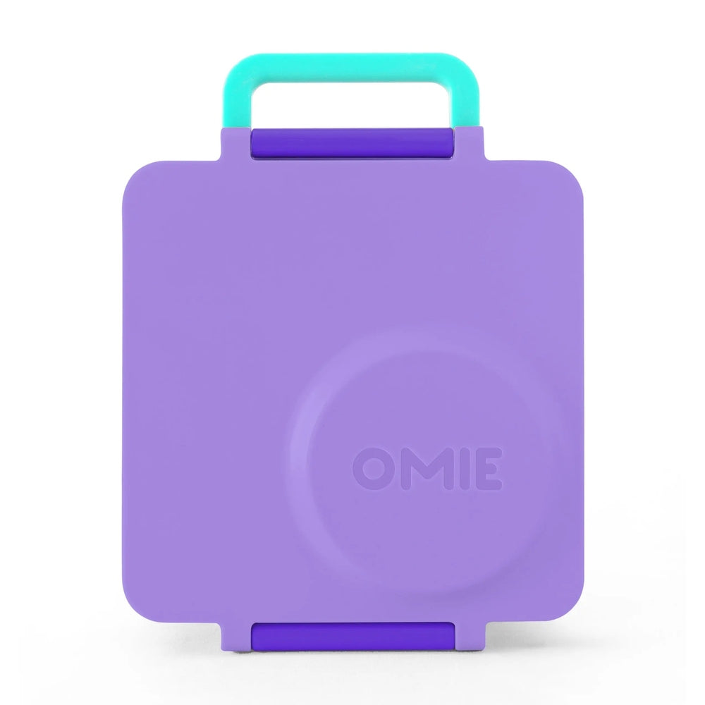Omielife Omiebox Version 2 lunch box in purple with a turquoise handle raised for easy carrying.