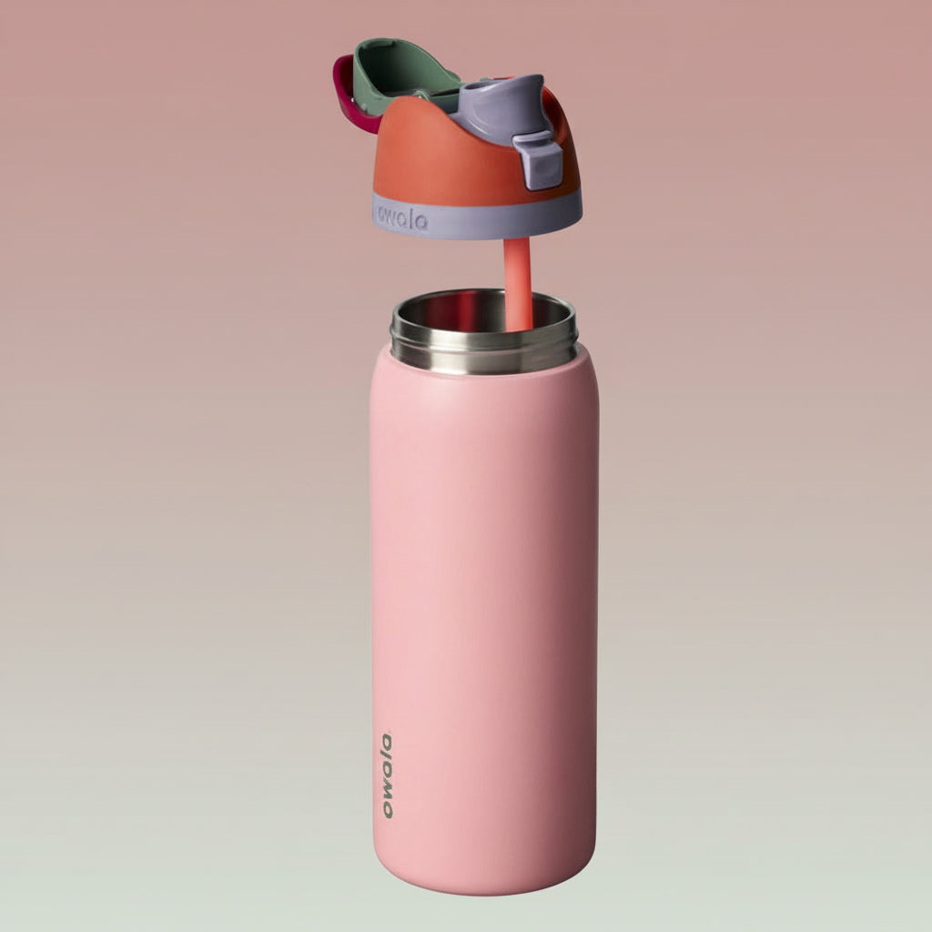 Pink water bottle with a colorful cap on a white background
