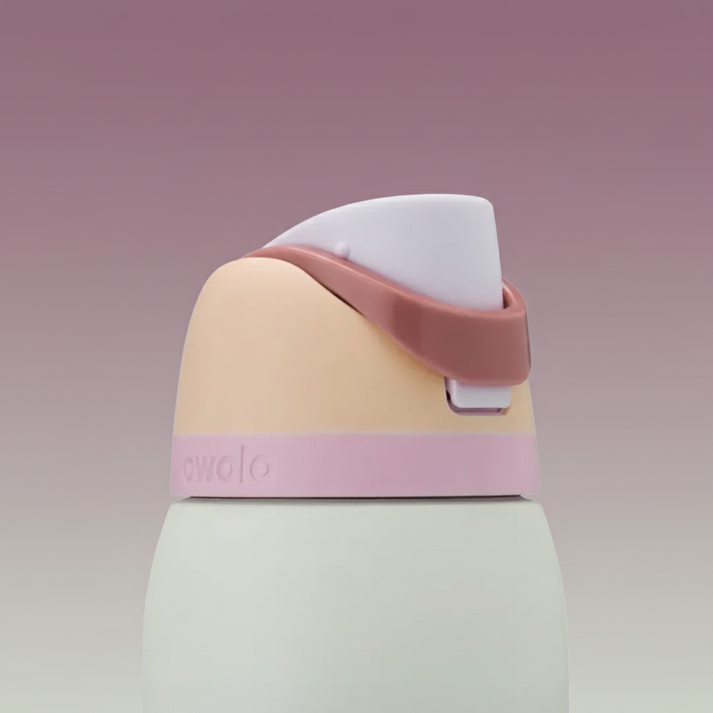 Multicolored water bottle with a pink cap on a white background