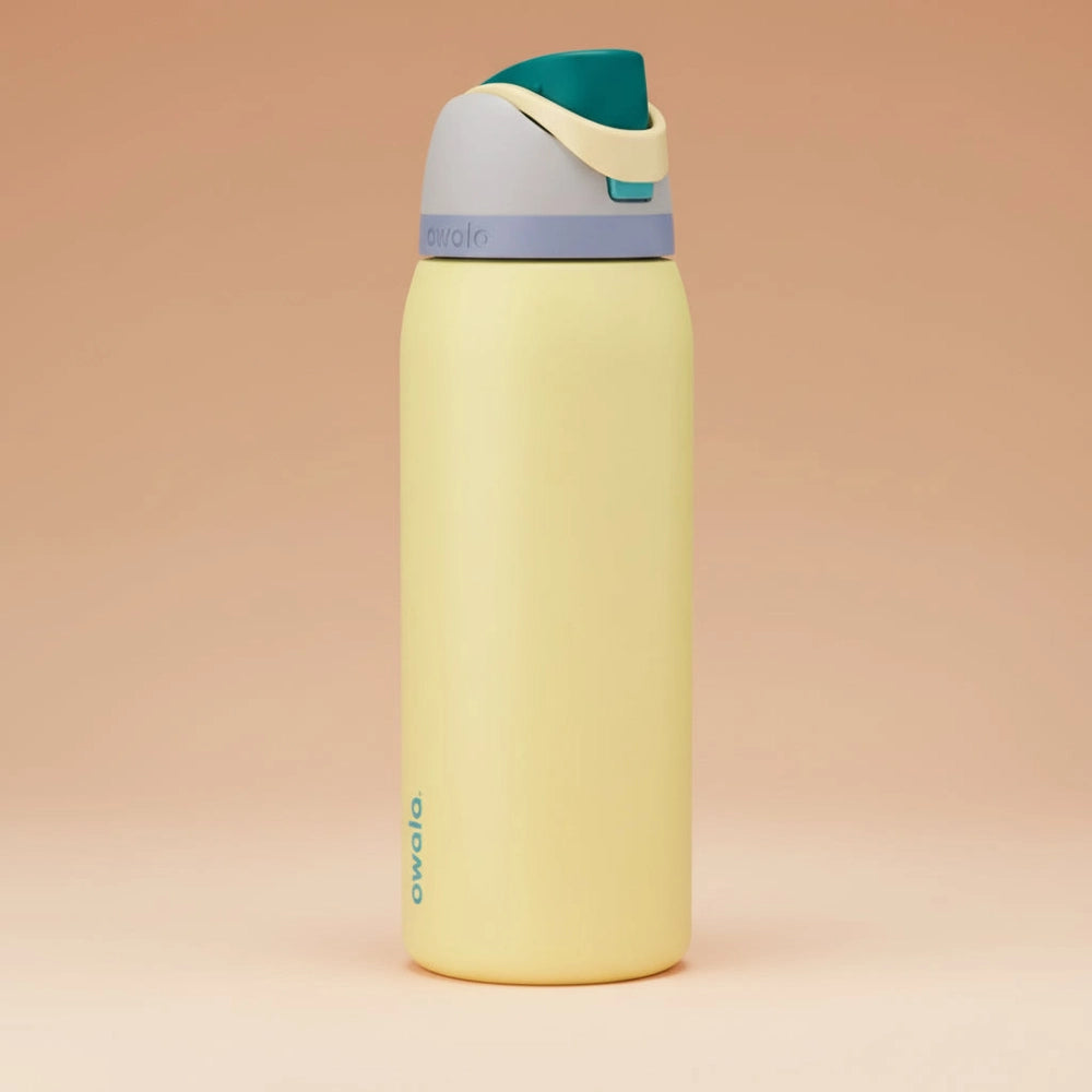 Yellow water bottle with a multicolored cap on a white background