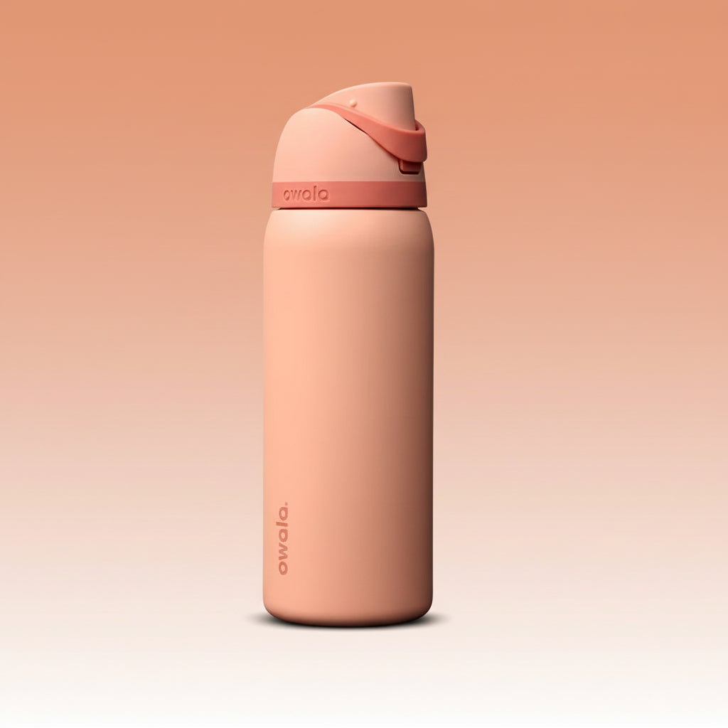 Peach-colored water bottle with a matching cap on a white background