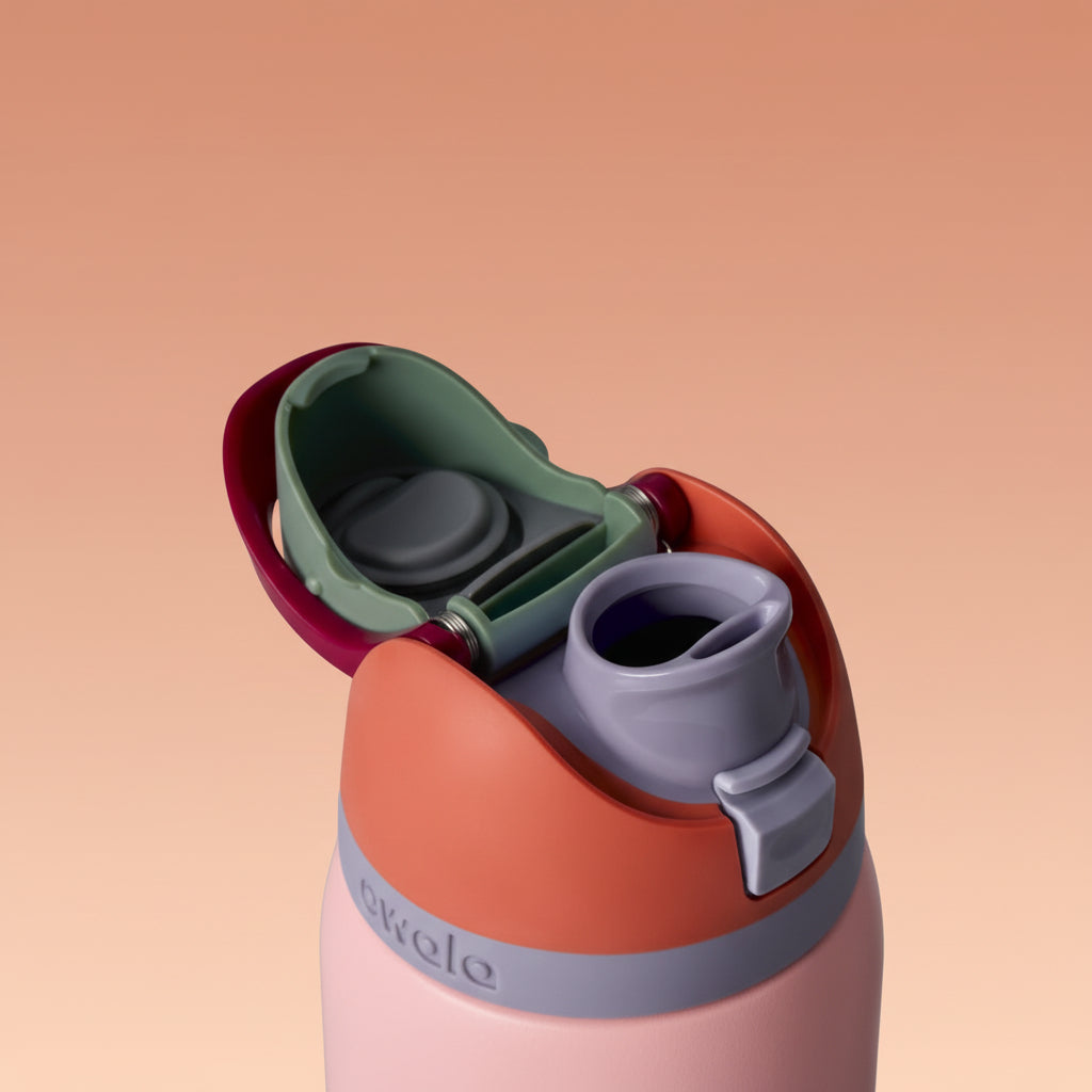 Colorful water bottle with a separate straw lid on a white background