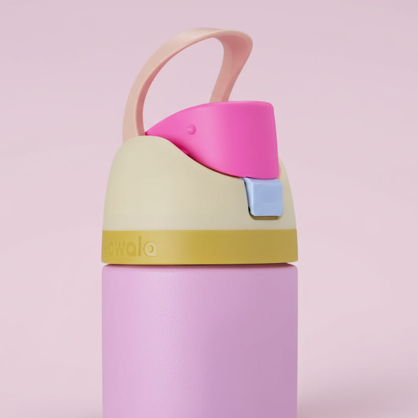 Colorful water bottle with a pink cap on a light pink background