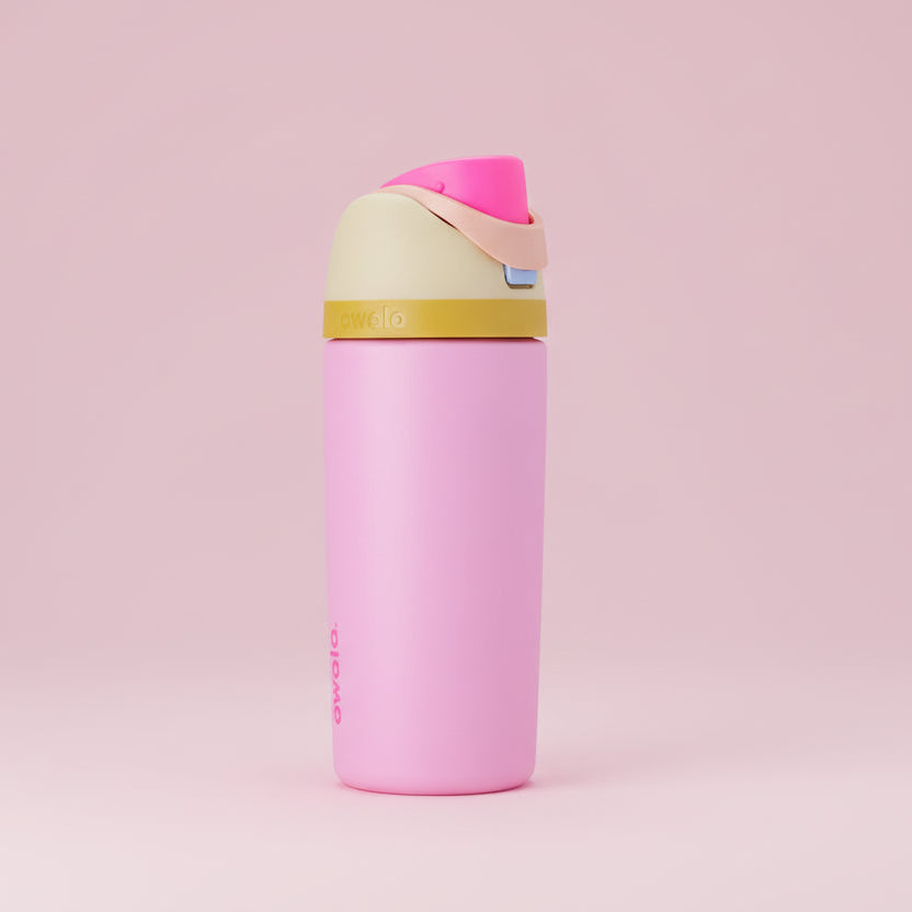 Pink water bottle with colorful cap on a pink background