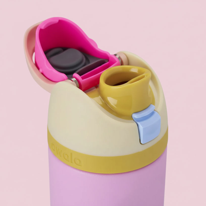 Colorful water bottle with pink top and beige body on a white background