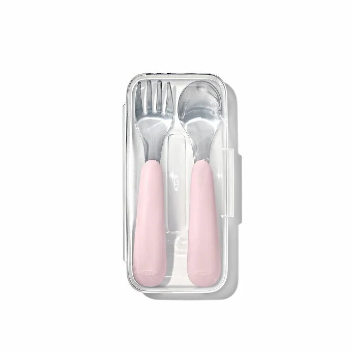 OXO Tot On-The-Go fork and spoon set with pink handles in a clear travel case