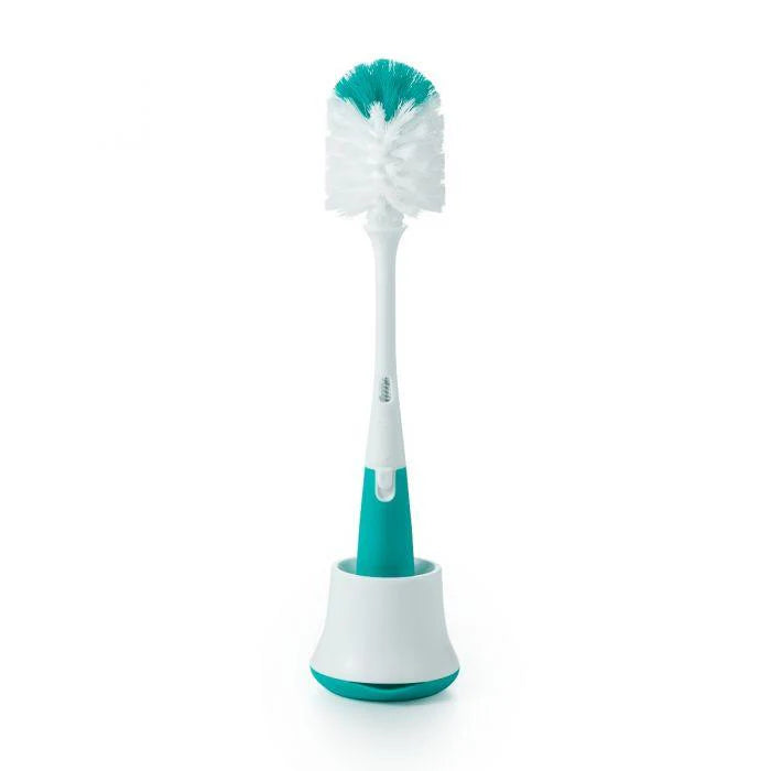 Oxo Tot soap dispensing bottle brush with stand in white and teal for baby feeding