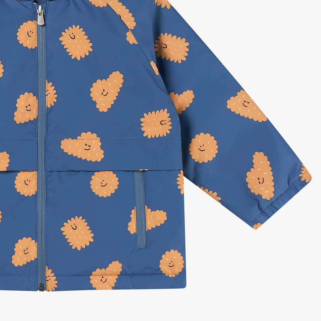 Nest Designs Biscuit Banter Waterproof Down Jacket shell detail with orange print, zip front, flap pocket and elasticated cuff