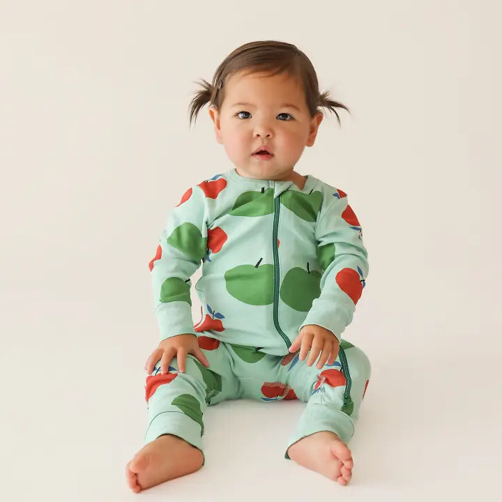 Parade Organic Signature Print 2-Way Zip Romper, mint with red apples; baby sits showcasing front zipper.