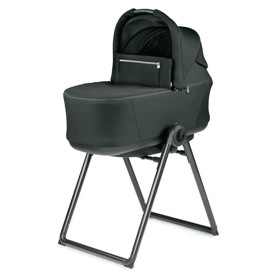 Peg Perego City Loop Stroller Bassinet on a sturdy metal stand in dark green, showing a zip pocket.