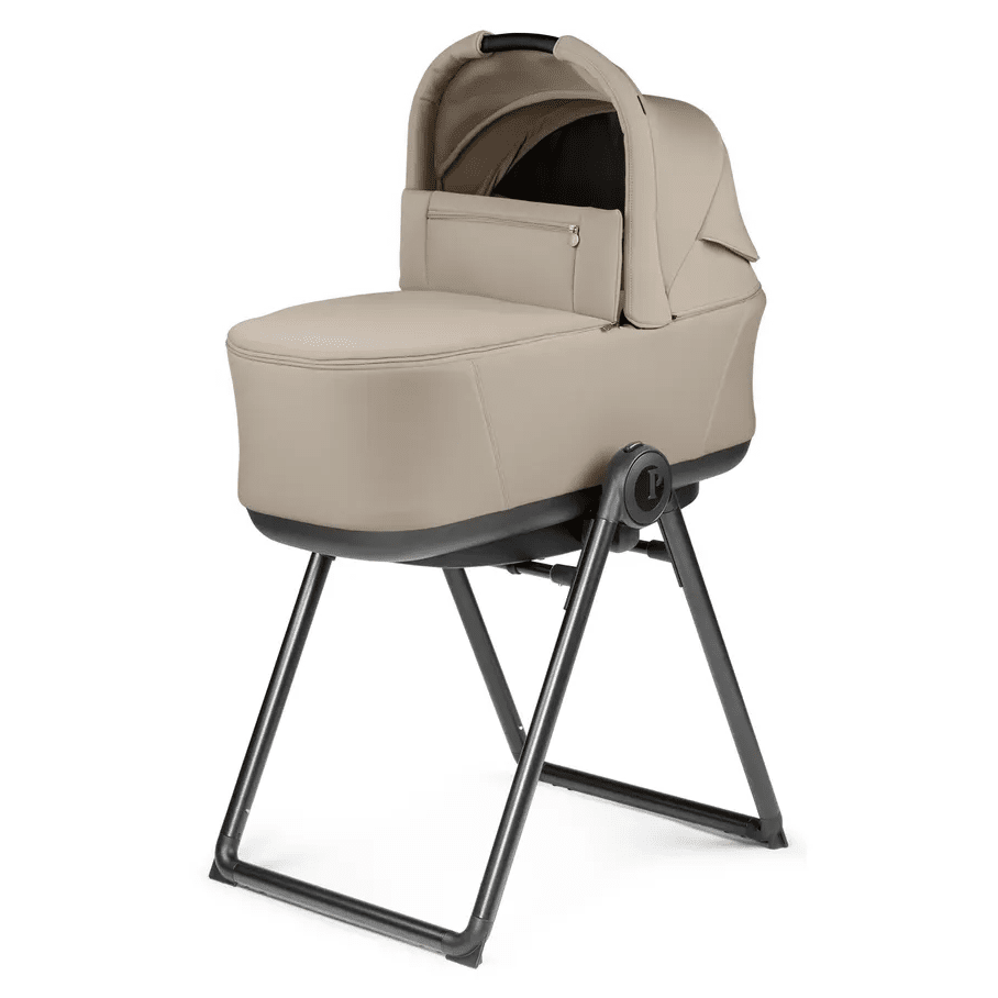 Peg Perego City Loop Stroller Bassinet W/Stand in beige, mounted on a sturdy metal stand with front storage pocket