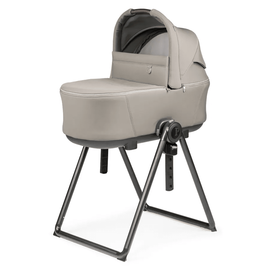 Peg Perego Culla Flex Bassinet on an adjustable-height black stand in beige, ready for newborns.