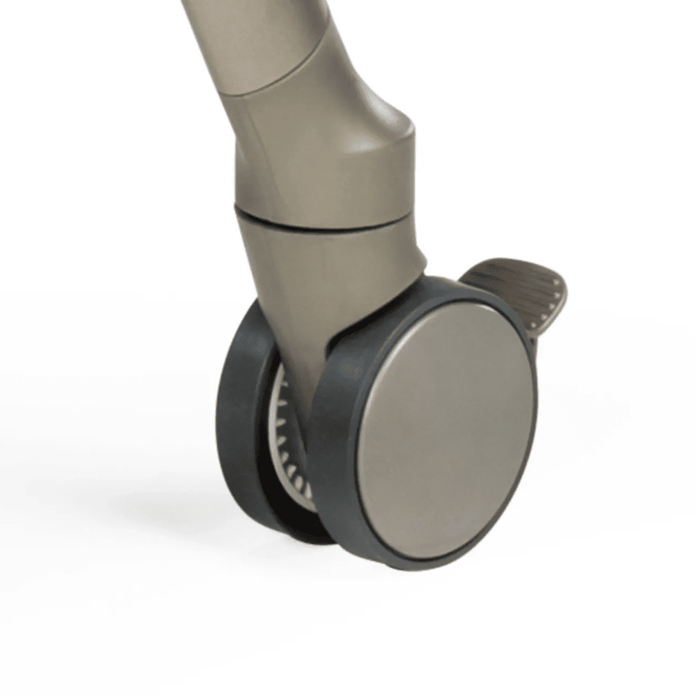 Peg Perego Living High Chair leg with large grey caster wheel and beige finish.