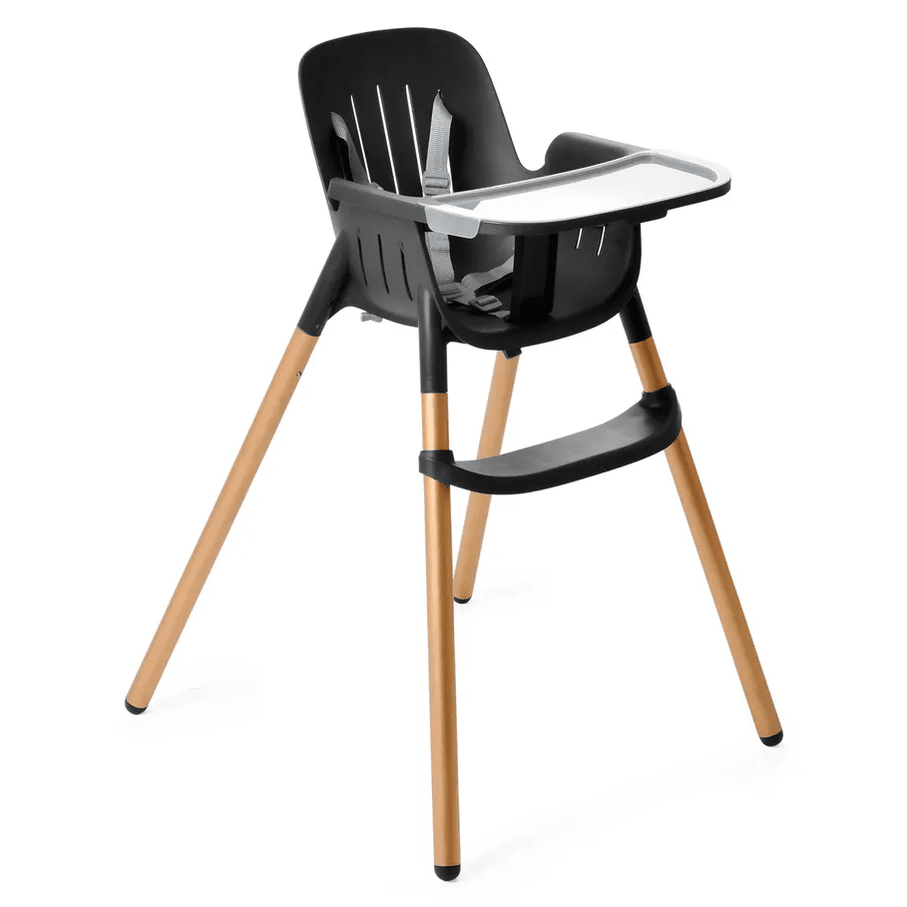 Peg Perego Poke High Chair in black with natural wood legs, tray attached and safety harness ready for meals.