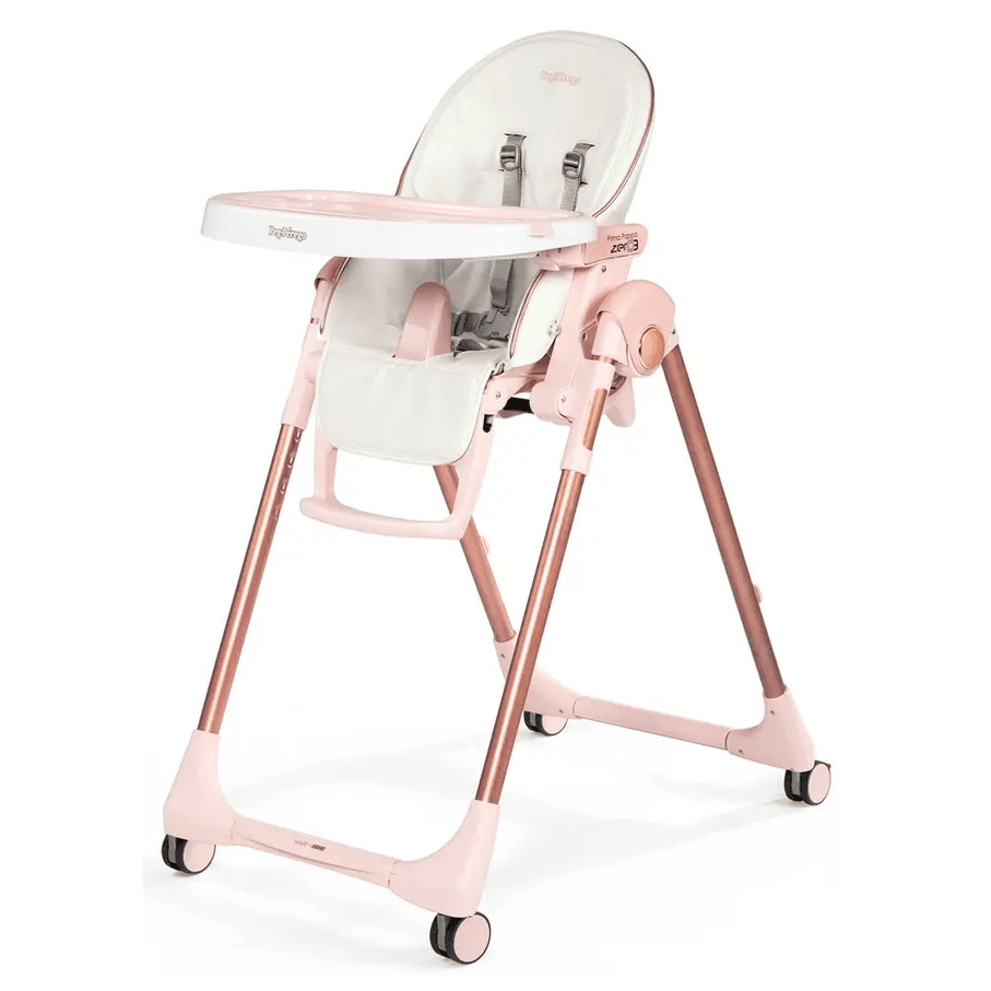 Peg Perego Prima Pappa Zero 3 high chair in pink with white tray, adjustable legs and wheels.