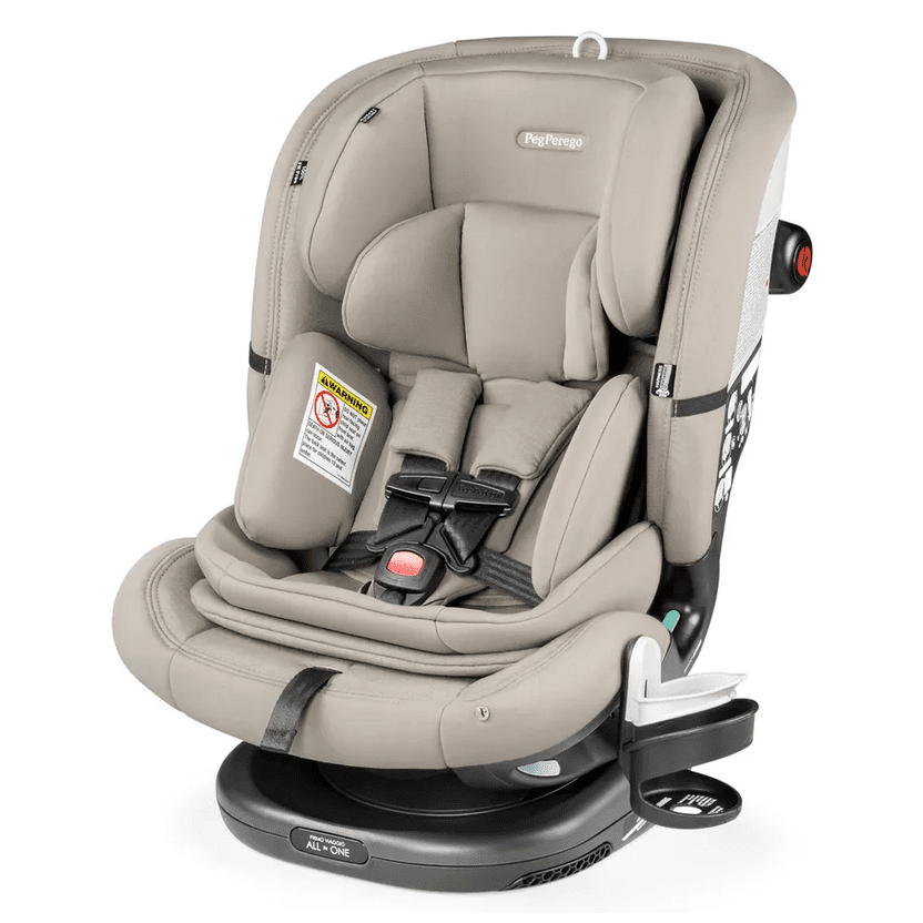 Peg Perego Primo Viaggio All In One car seat in beige, installed on base with 5-point harness buckled.