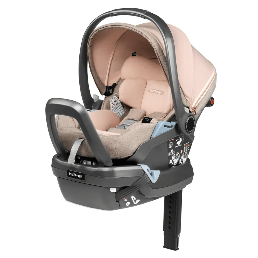 Peg Perego Primo Viaggio Lounge Infant Car Seat in pink-beige, reclined on adjustable base with carry handle.