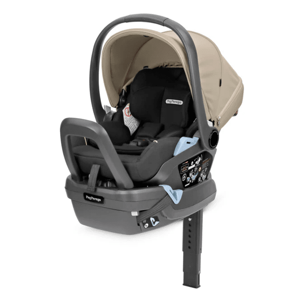 Peg Perego Primo Viaggio Lounge Infant Car Seat in beige with gray base, showing recline and secure base attachment.