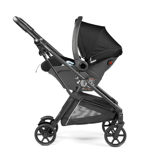 Peg Perego Primo Viaggio Lounge on wheels infant travel system stroller with car seat attached, black canopy.