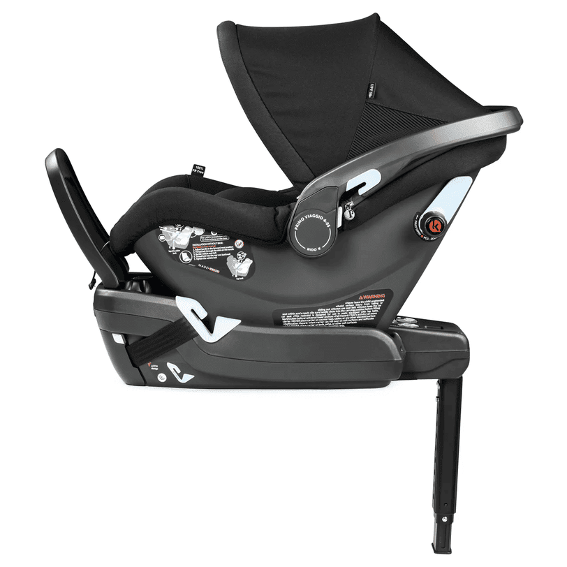Peg Perego Primo Viaggio Nido infant car seat in black, attached to its base with extended leg for stability.