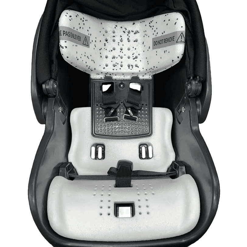 Peg Perego Primo Viaggio Urban Mobility Infant Car Seat base, gray cushioning with harness slots and buckle.