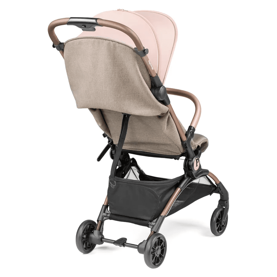 Peg Perego VOLO Travel Stroller in beige fabric with brown frame and lower storage basket.