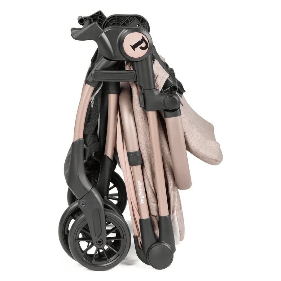 Peg Perego VOLO Travel Stroller, rose-gold frame, folded with wheels tucked, ready to carry.
