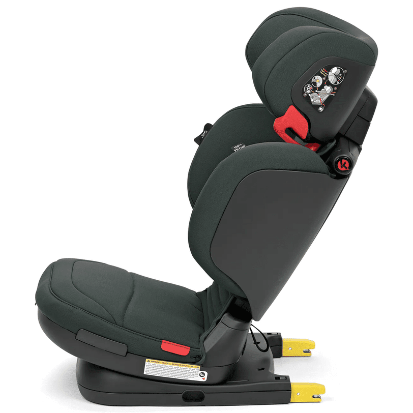 Peg Perego Viaggio Flex 120 booster seat in dark green fabric, shown installed with red buckle and yellow ISOFIX connectors.