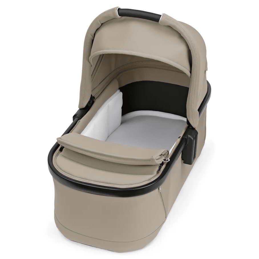 Peg Perego YPSI Bassinet with Stand By Me in beige, canopy overhead and padded interior shown ready for use