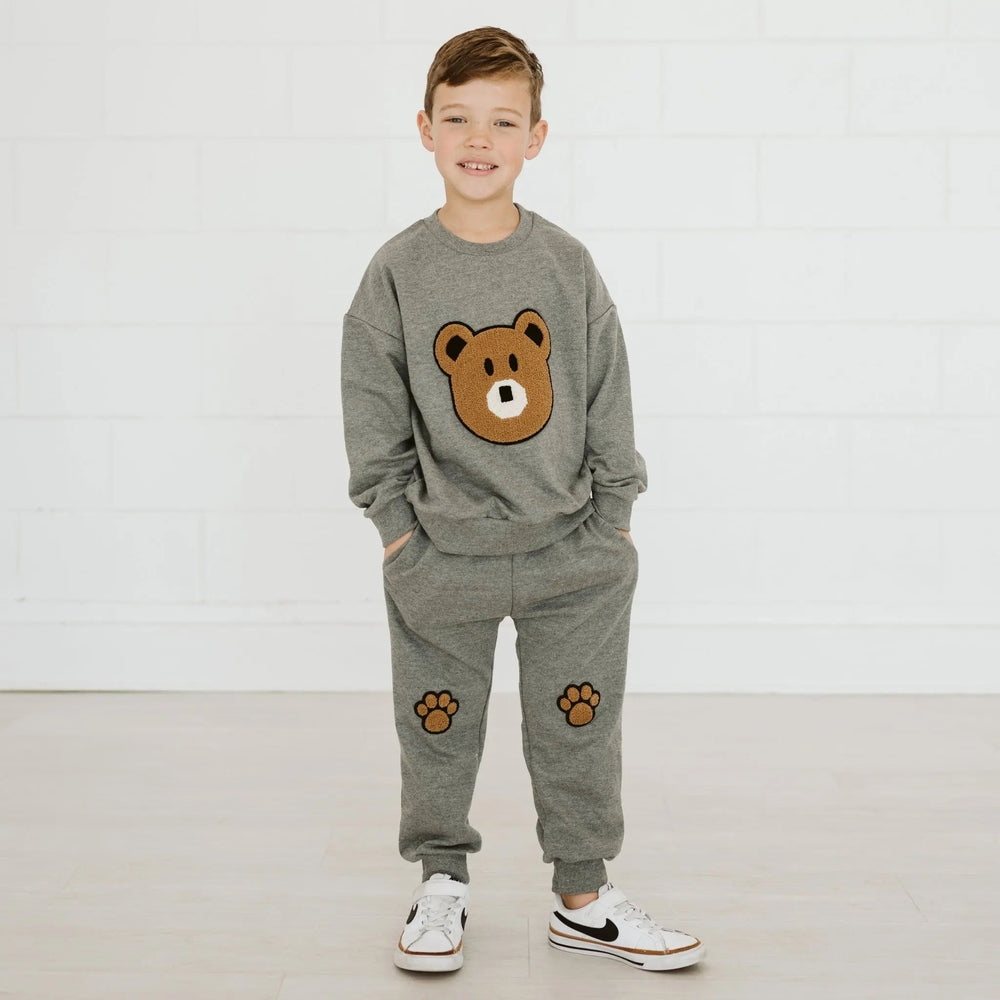 Petite Hailey Bear Sweatshirt Gray with matching joggers; child models cozy loungewear with bear face and paw prints.