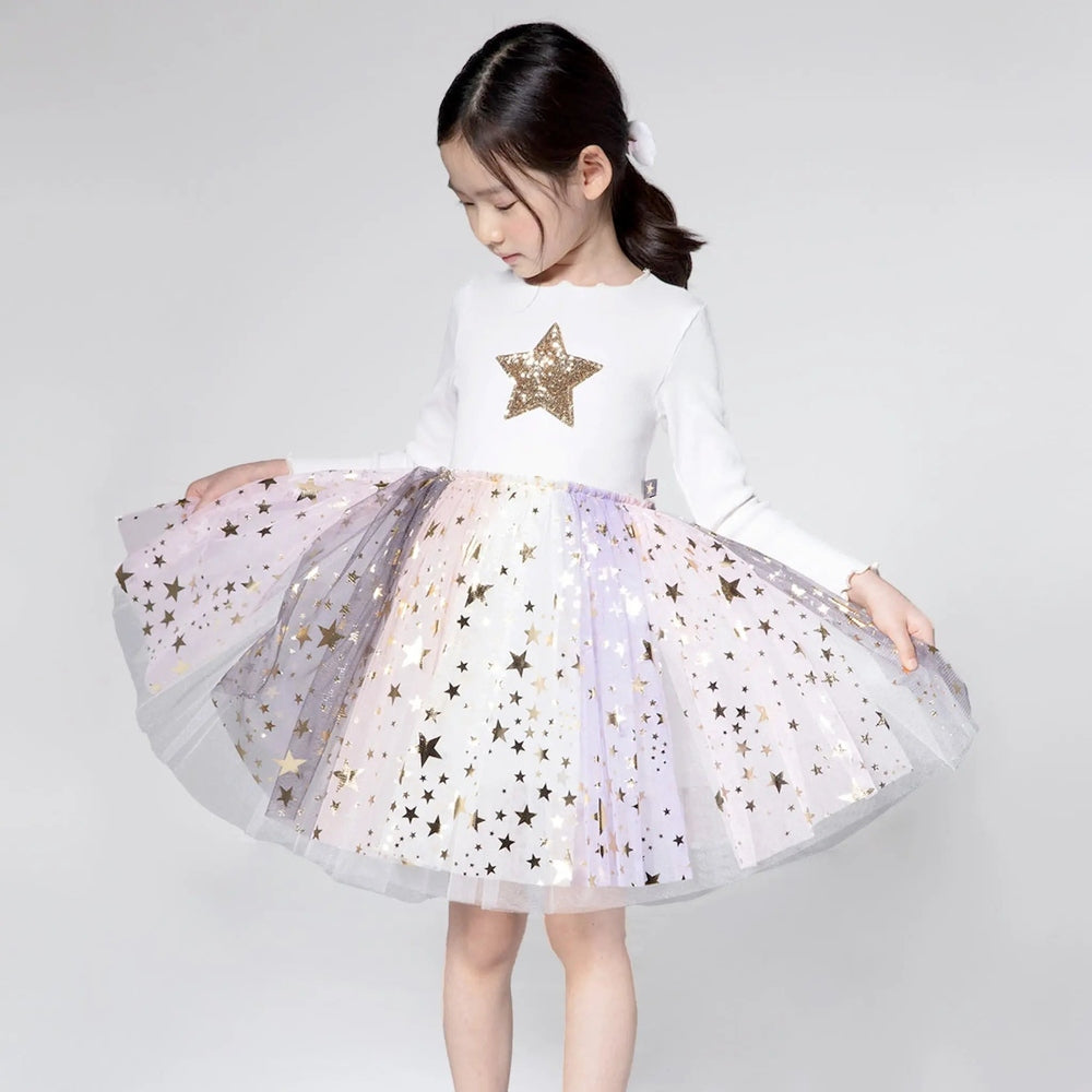 Petite Hailey Multi Cut Ph Tutu girl twirls, pastel tulle with gold star confetti over a white top.