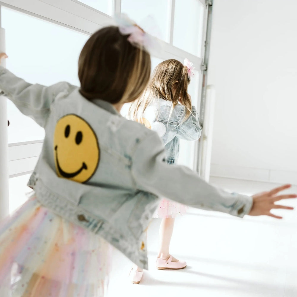 Petite Hailey Patched Denim Jacket, light blue with yellow smile patch, worn by two girls.