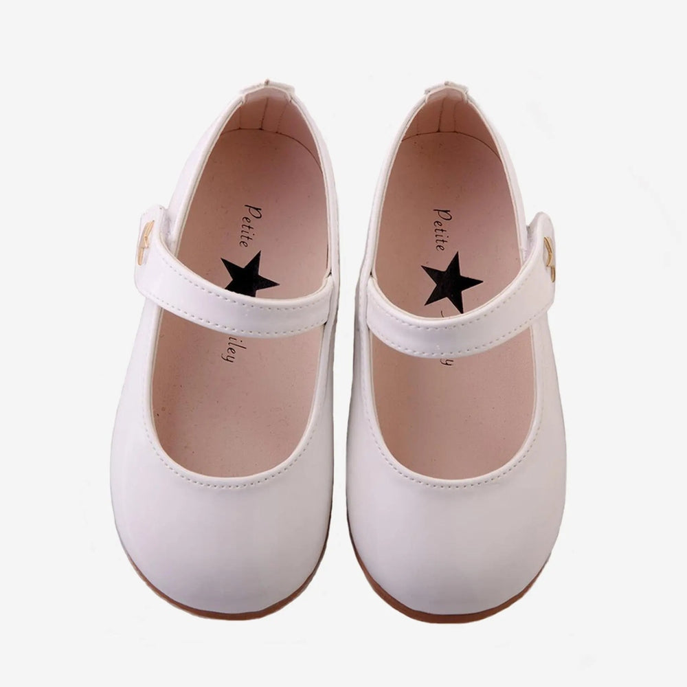 Petite Hailey Patent Mary Jane Shoes White, pair shown with adjustable strap fasteners visible.