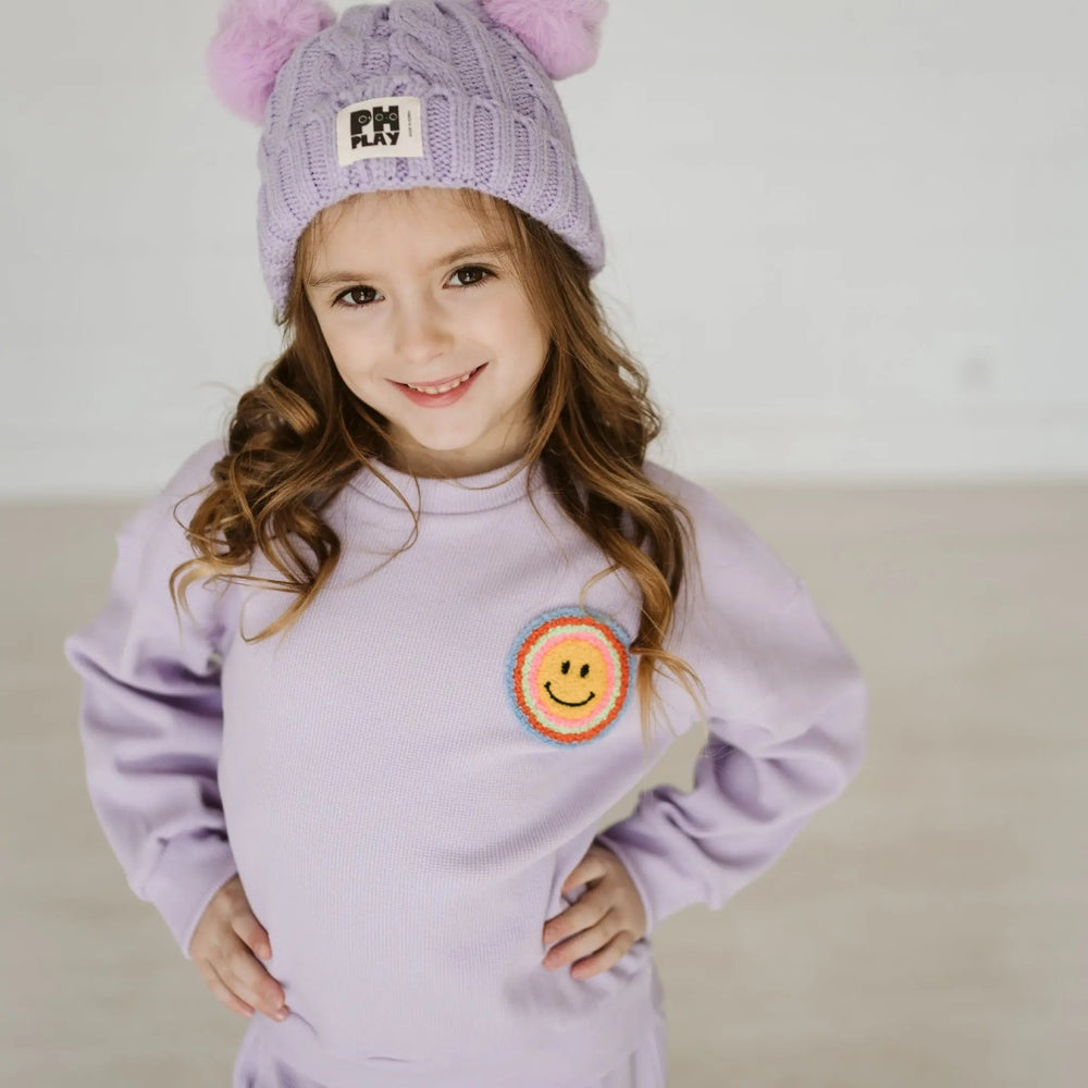 Petite Hailey Waffle Multi Smile Set Purple worn by girl in lavender beanie, lavender knit top with smile patch.