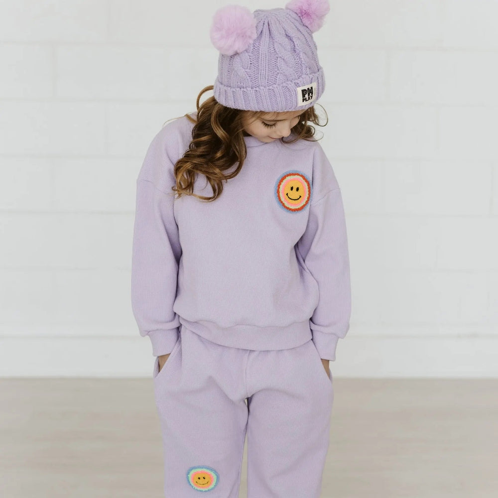 Petite Hailey Waffle Multi Smile Set Purple; lavender knit loungewear with smile patches, worn with matching pom-pom beanie.