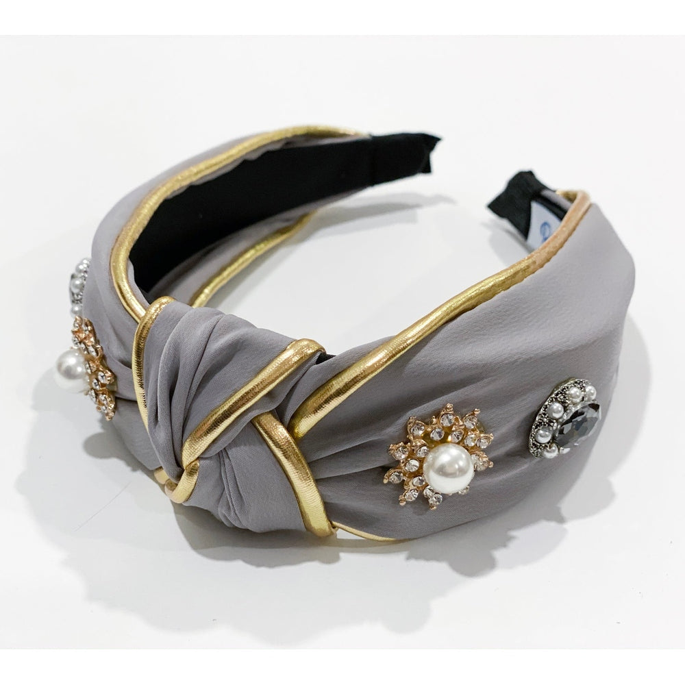 Petite Maison Kids Kylie headband in gray fabric with gold trim and crystal pearl embellishments.