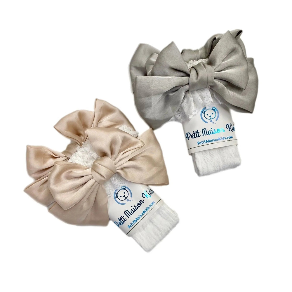 Petite Maison Kids Lola Lace Socks with Satin Bows in beige and gray, lace trim tied with oversized satin bows.