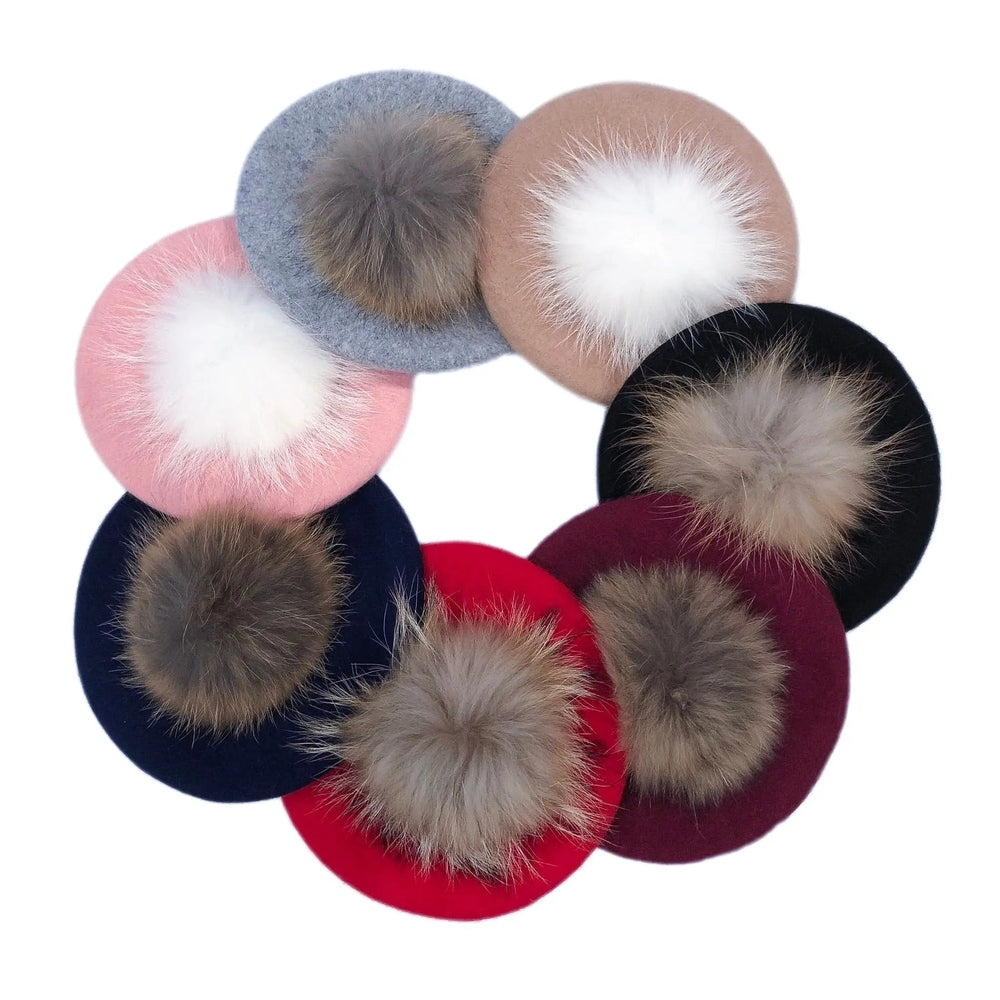 Petite Maison Kids Wool Beret With Pom Pom; a 9-pack of colorful berets each with a fluffy fur pom.