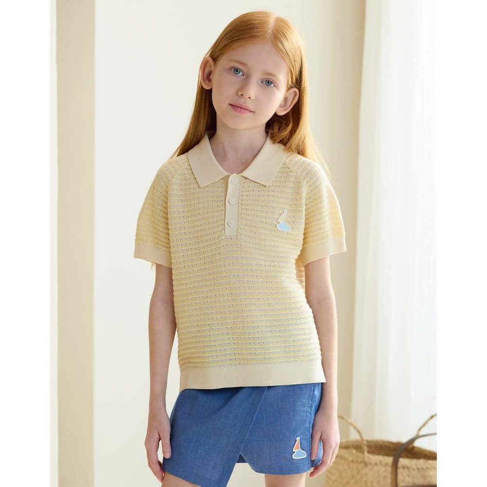 Petite Revery Cotton Knit Short Sleeve Top Mellow Yellow worn by a girl, showing polo collar, buttons and knit texture.