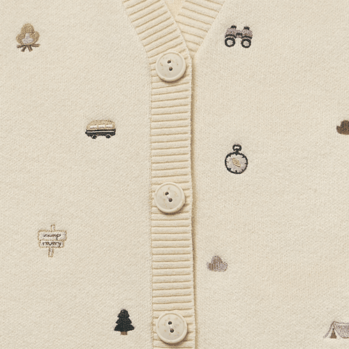 Petite Revery cotton knit vest in cream with ribbed front placket and tiny embroidered icons