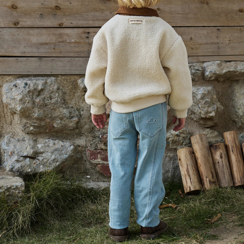 Petite Revery denim jeans in dusk sky blue with cloud embroidery on back pockets