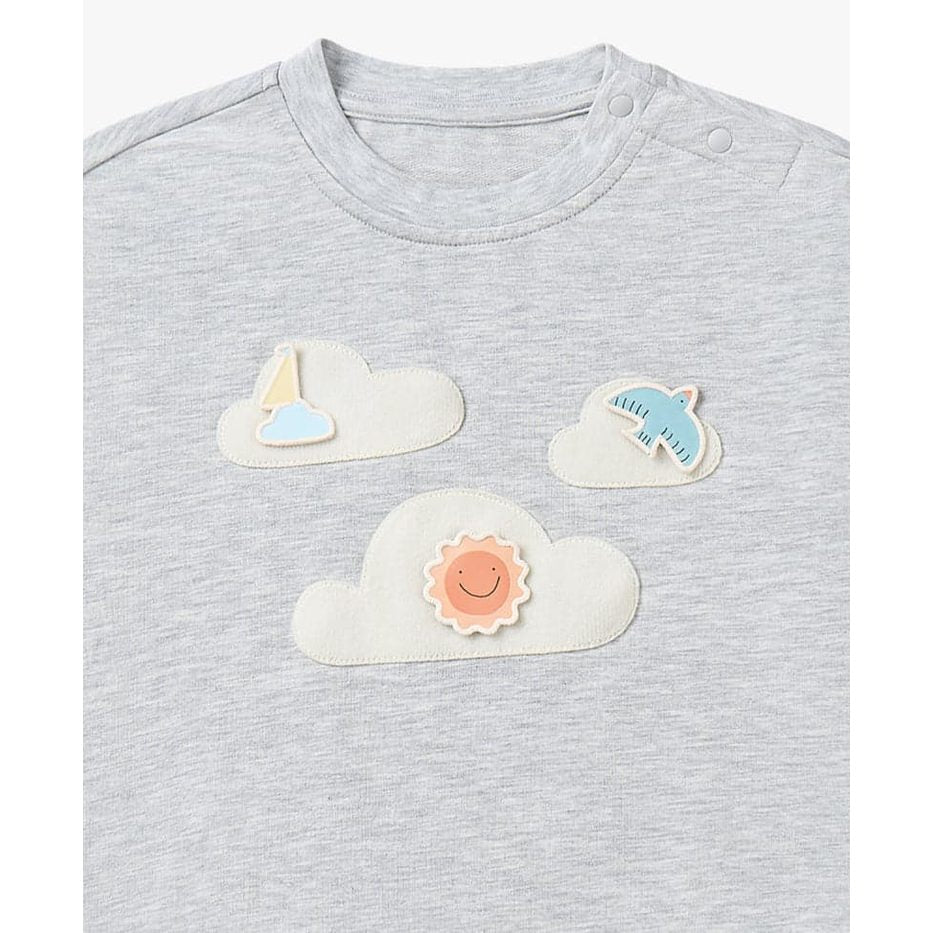PETITE REVERY drop-shoulder baby sweatshirt in fog grey with three felt cloud patches featuring sun, sailboat, and plane.
