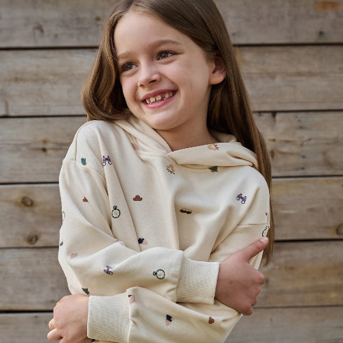 PETITE REVERY kids hooded sweatshirt in cream French Terry with tiny colorful prints.