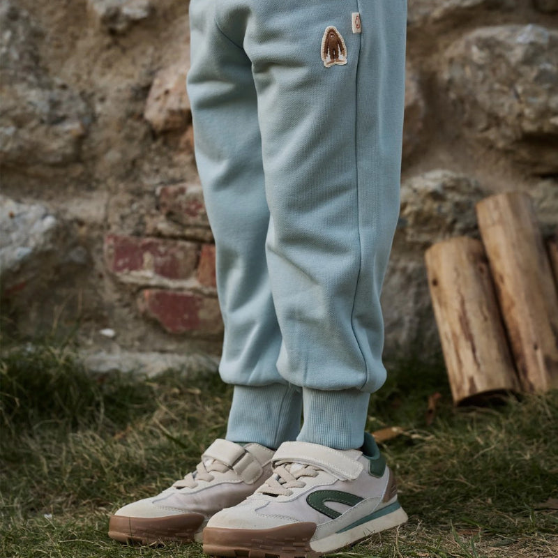 Petite Revery slate French terry joggers for toddlers with ribbed cuffs and a brand patch.
