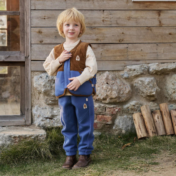 PETITE REVERY kids' down vest in deep sea blue with brown trim and matching pouch